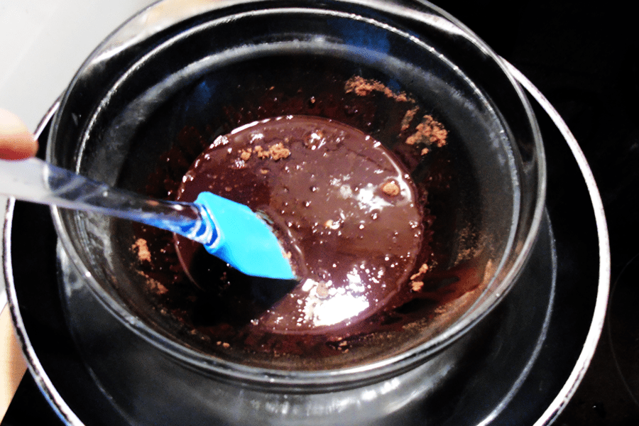 Create a ' Bain-marie' aka hot water bath. I simply used a big Wok pan and a heat resistant bowl. If you are using xylitol, put that first as you don't want to end up with a grainy chocolate. Once that's melted put in all the rest of the ingredients.